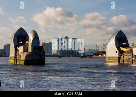 Thames Barrier and skyline of Canary Wharf with the landmark corporate office buildings Stock Photo