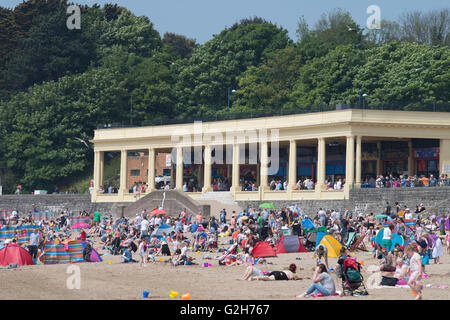 A packed busy beach at Whitmore Bay, Barry Island, South Wales, on a warm sunny summers day. Stock Photo