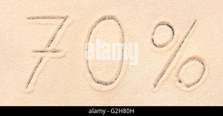 70 % lettering written on sand. Summer beach background Stock Photo