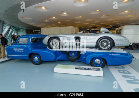 The high-speed racing car transporter Mercedes-Benz (Blue Wonder) and racing sports car Mercedes-Benz 300 SLR on the trailer. Stock Photo