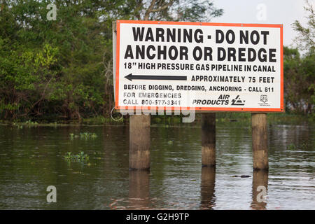 Warning sign for gas pipeline in Atchafalaya Swamp, the largest wetland in the United States Stock Photo