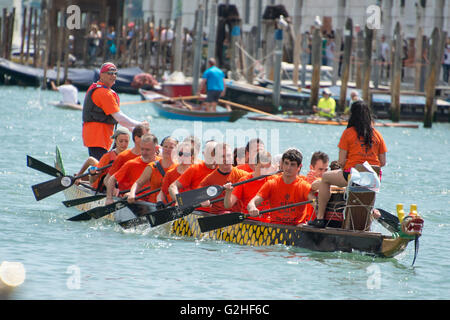 Rowers from many countries participate in the 42nd Vogalonga regatta on the Grand Canal near the the Basilica della Salute in Venice, Italy on Sunday, May 15, 2016. The Vogalonga, a non-competitive recreational sporting event for amateur athletes, is part of the annual ·Venice International Dragon Boat Festival.' The Grand Canal is closed to motor-driven boats during the event. Credit: Ron Sachs/CNP - NO WIRE SERVICE - Stock Photo