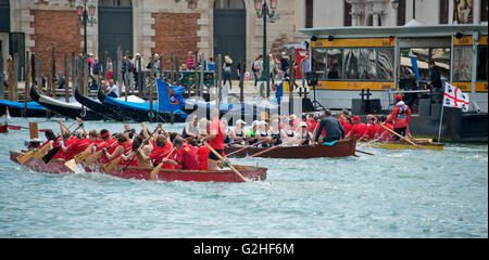 Rowers from many countries participate in the 42nd Vogalonga regatta on the Grand Canal near the the Basilica della Salute in Venice, Italy on Sunday, May 15, 2016. The Vogalonga, a non-competitive recreational sporting event for amateur athletes, is part of the annual ·Venice International Dragon Boat Festival.' The Grand Canal is closed to motor-driven boats during the event. Credit: Ron Sachs/CNP - NO WIRE SERVICE - Stock Photo