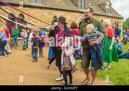 Oakham, Rutland, England,UK., 30th May 2016. Oakham Castle was re-opened after £2m worth of restoration work was completed, the money provided by the Heritage Lottery Fund. To celebrate the re-opening many Norman themed events were held in the castle grounds including coin striking,archery, the making of chain mail and much more. Maypole dancing was one of the events taking place Credit:  Jim Harrison/Alamy Live News Stock Photo