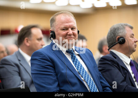 Stuttgart, Germany. 31st May, 2016. Nikolai Tsukanov, Governor of the region Kaliningrad in Russia, listening to the speech of Russian Minister for Economic Affairs Alexej Uljukajew at the Chamber for Industry and Commerce Stuttgart Region in Stuttgart, Germany, 31 May 2016. PHOTO: DENIZ CALAGAN/dpa/Alamy Live News Stock Photo