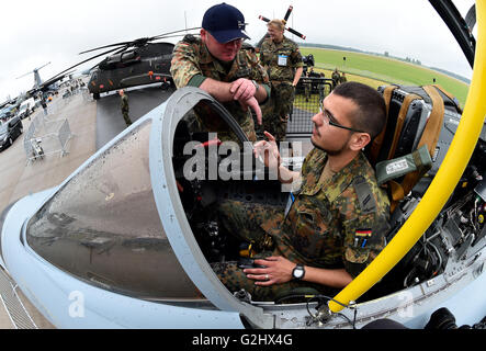 Schoenefeld, Germany. 01st June, 2016. A Bundeswehr soldier sits in a Tornado aircraft at the Berlin Air Show (ILA) in Schoenefeld, Germany, 01 June 2016. The air show at Berlin-Schoenefeld Airport is open from 01 to 04 June 2016. Photo: BERND SETTNIK/dpa/Alamy Live News Stock Photo