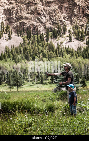 Dad and Young Son Fly Fishing Stock Photo