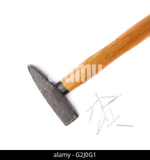 Big hammer with pile of nails over white isolated background Stock Photo