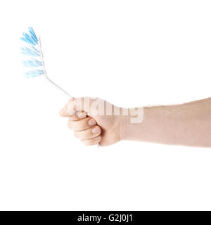Hand holding a dish brush , composition isolated over the white background Stock Photo