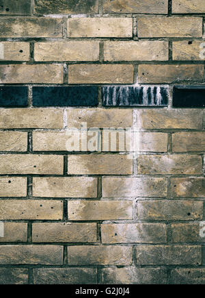 Old dirty brick wall with white paint black brick line texture background Stock Photo