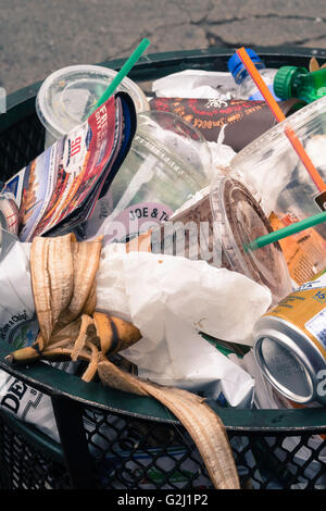 Trash can on an urban street, NYC Stock Photo