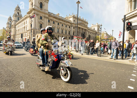 Mods riding their scooters through Parliament Square for the London to Brighton Scooter Rally in May 1st 2016 Stock Photo