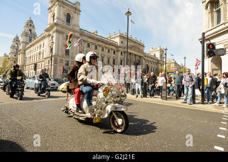 Mods riding their scooters through Parliament Square for the London to Brighton Scooter Rally in May 1st 2016 Stock Photo