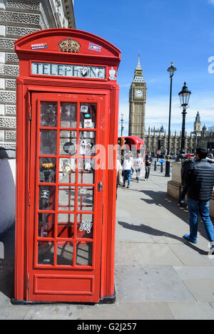 Classic Red Telephone box in London Parliament Square, with Big Ben in the background on a summer's day of May the 1st 2016 Stock Photo