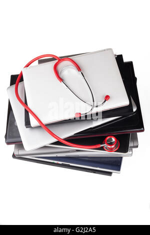 Laprops upper view with red stethoscope isolated on white background Stock Photo