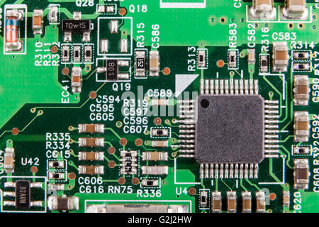 Micro Chip  macro close-up on green circuit board Stock Photo