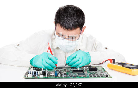 Man measuring on elecrtronic circuit board with 2 probes isolated on white Stock Photo