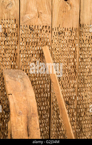 Vintage thresher made of wood and flint stone. Stock Photo