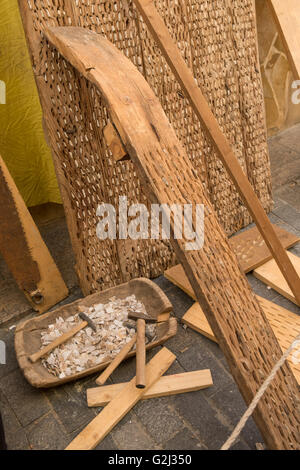 Vintage thresher made of wood and flint stone. Stock Photo