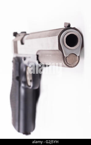 Silver color pistol closeup isolated on white background Stock Photo