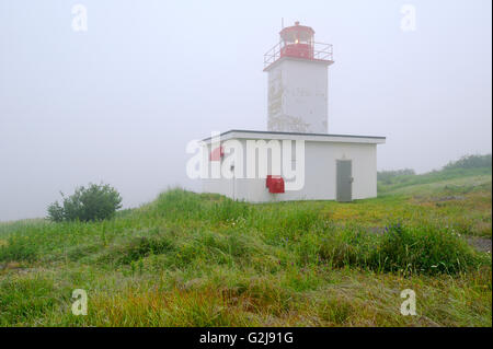 Quaco Head Lighthouse in fog on Bay of Fundy Saint Martins New Brunswick Canada Stock Photo