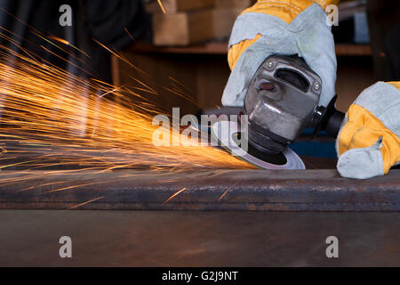 mteal grinding with orange flying sparks Stock Photo