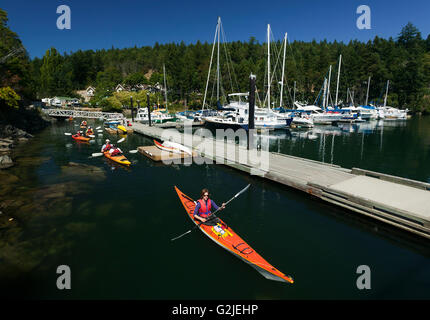 Kayakers depart from Otter Bay Marina on North Pender Island a day Kayaking North Pender Island Southern Gulf Islands,Gulf Stock Photo