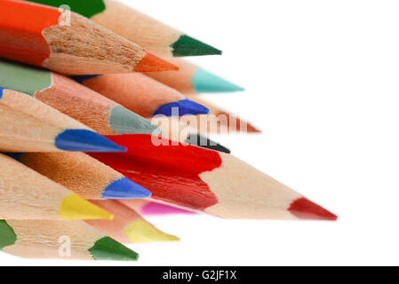 A lot of pencils with different color and red pencil in front