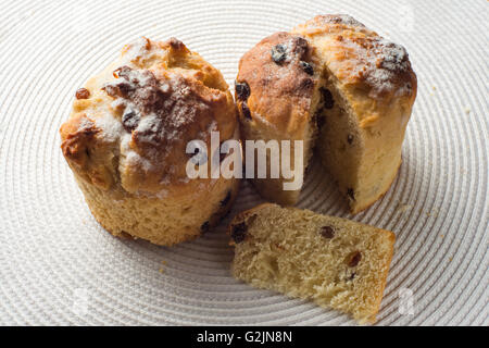 pair of homemade carrot muffins on white fabric background. top view Stock Photo