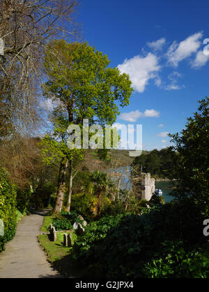 The church of St Just in Roseland, Cornwall stands on the bank of a creek of the Fal. Stock Photo