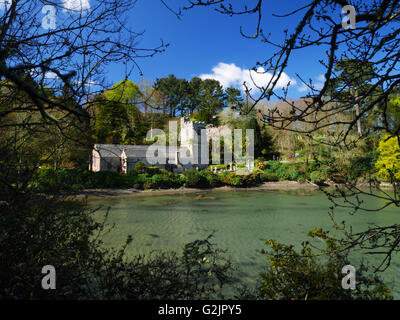 The church of St Just in Roseland, Cornwall stands on the bank of a creek of the Fal. Stock Photo