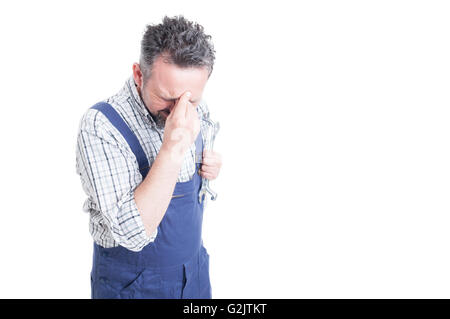 Man holding head with hand looking worried and anxious as failure and sorrow concept isolated on white background with copyspace Stock Photo