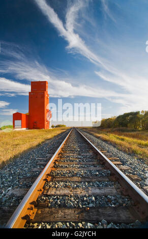 old grain elevator and railway tracks, Carey, Manitoba, Canada Stock Photo