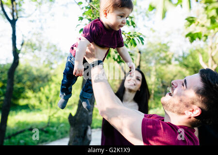 young family with a child on the nature Stock Photo
