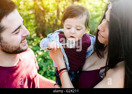 young family with a child on the nature Stock Photo