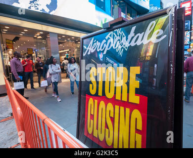 The Aéropostale store in Times Square store in New York on Tuesday, May 24, 2016 is festooned with store closing signs. The embattled teen retailer Aéropostale has filed for Chapter 11 bankruptcy protection after 13 straight quarters of losses. The company will close 113 U.S. stores and 41 in Canada. (© Richard B. Levine) Stock Photo