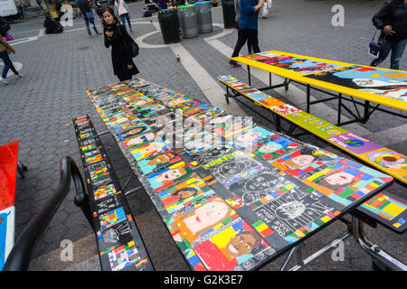 School lunchroom tables decorated with art representing various social issues are seen in Union Square Park in New York on Tuesday, May 24, 2016. The tables are a project by LeAp's public art program where young people worked with artists to create works that reflect current issues that effect them. Learning through an Expanded Arts Program (LeAp) displayed the tables as part of the kick-off for the campaign. Starting in June and through August the ten tables will be placed in ten different parks throughout the city. (© Richard B. Levine) Stock Photo