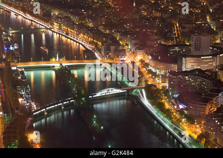 Aerial Night view of Paris City and Seine river shot on the top of Eiffel Tower Stock Photo