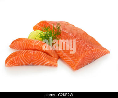 Fillet of Atlantic salmon (Salmo salar), slices of lime (Citrus aurantiifolia) and dill (Anethum graveolens), white background Stock Photo