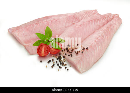 Fillets of Nile perch (Lates niloticus), peppercorns (Piperaceae), tomato (Solanum lycopersicum) and mint (Mentha sp.) Stock Photo