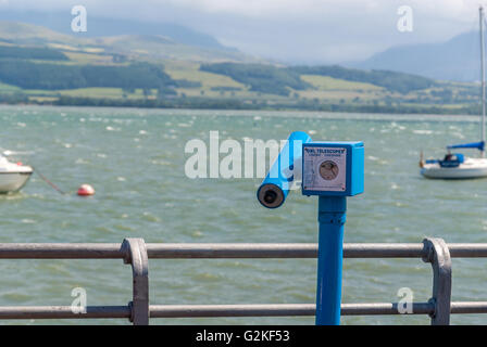 Coin operated tourist viewing telescope on Beaumaris pier in Anglesey looking out over the Menai Straits Stock Photo