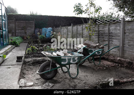 HARD LANDSCAPING UNDERWAY IN A RURAL BACK GARDEN. UK Stock Photo