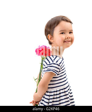 Smiling girl hiding a bouquet of red carnations behind herself Stock Photo