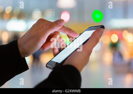 Close up of woman hand text messaging Stock Photo