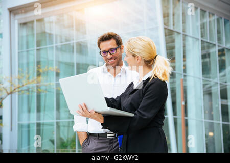Business people meeting in financial district Stock Photo