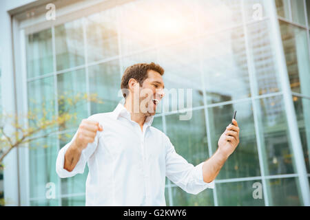 Businessman celebrating his success Stock Photo