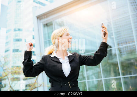 Businesswoman celebrating his success Stock Photo