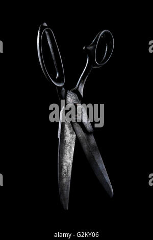 Pair of Old Scissors on Black Stock Photo