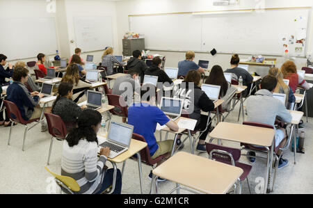 Students taking a test on laptops in a high school classroom. The test is the national PARCC test Stock Photo