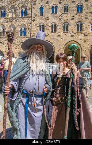 Man & Woman in costume, Volterra, a walled mountaintop town in the province of Pisa in the Tuscany region, Italy. Stock Photo